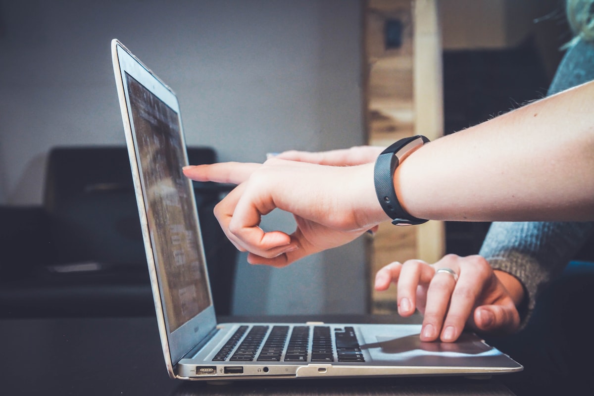 People collaborating with laptops